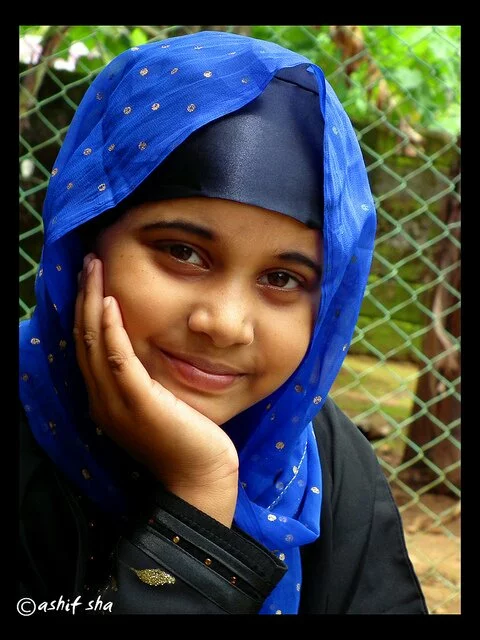 beautiful Muslim Girl in blue Hijab with smile